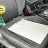Better Earthing Auto Seat Mat on a black car seat, used to discharge built-up electrical energy from your body to the metal floor and chassis of the vehicle.