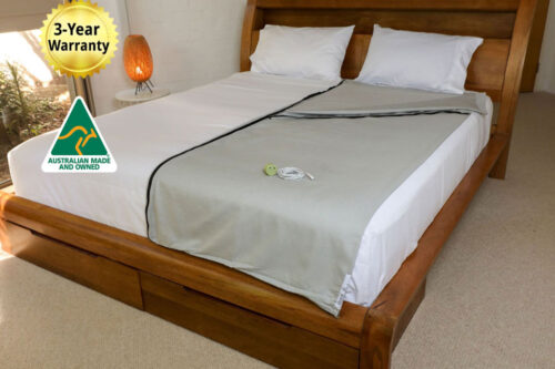 Better Earthing Recovery Bag placed on a bed in a calm bedroom with wooden furniture and soft lighting, used for grounding and EMF shielding to support more restful and uninterrupted sleep.