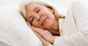 Older woman with arthritis sleeping peacefully, showing natural relief from inflammation.